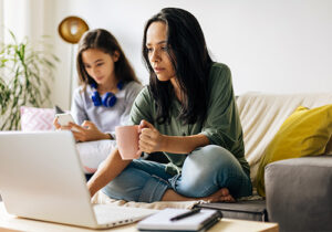 Woman looks up mental health services for teens on her computer