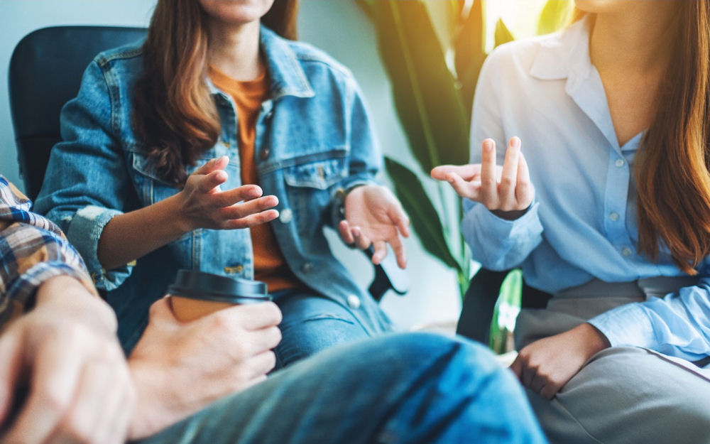 teen girl thriving in social setting with peers after success with cognitive behavioral therapy program