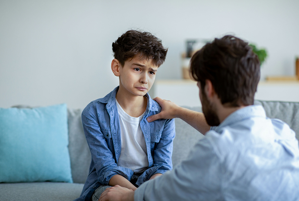 Parent noticing signs of emotional distress in their child at home.