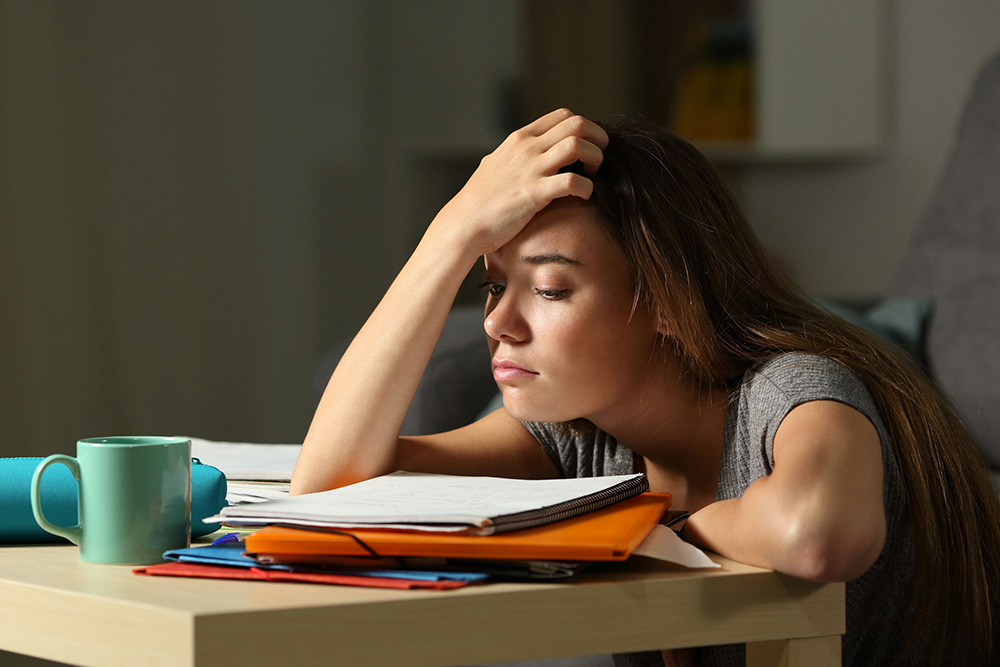 Teen facing stress, peer pressure, and family challenges that increase risk of bipolar disorder and substance use