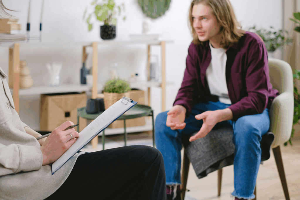Teen and therapist in a supportive counseling session, highlighting the benefits of EMDR therapy for teens