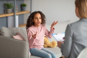Teen speaking with a mental health therapist during OCD treatment at the Ohio Center for Adolescent Wellness.