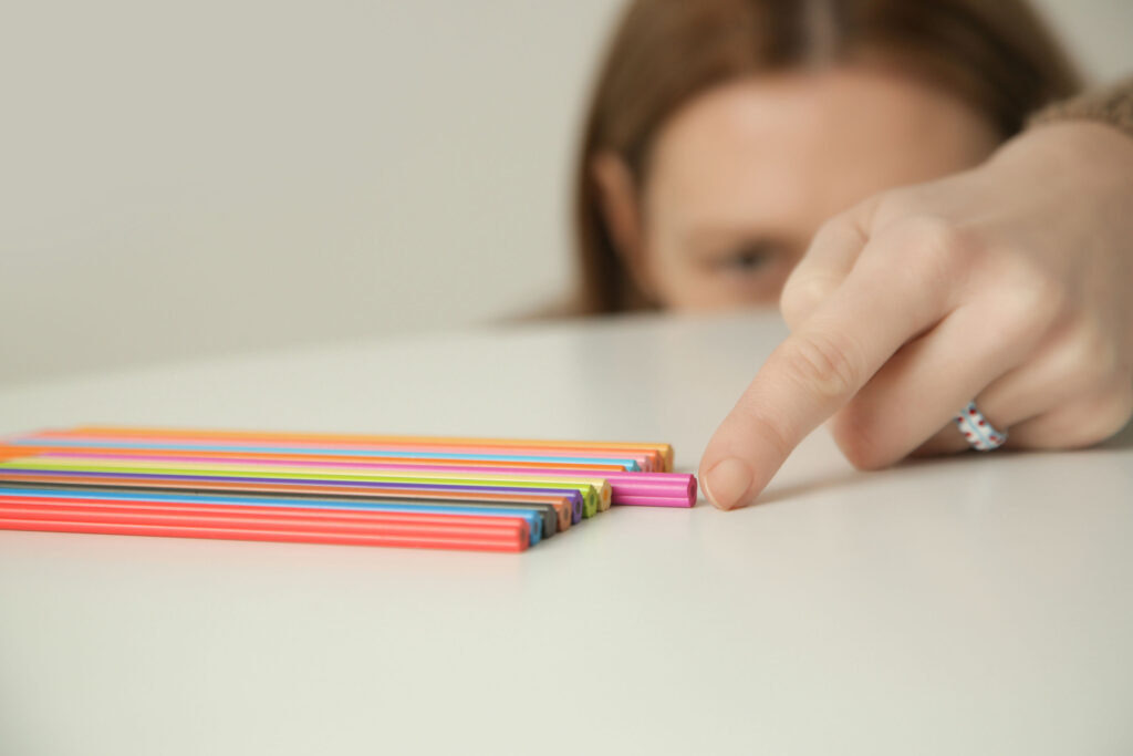 Teen engaging in compulsive behaviors such as obsessing over organization and perfectionism, common OCD symptoms.