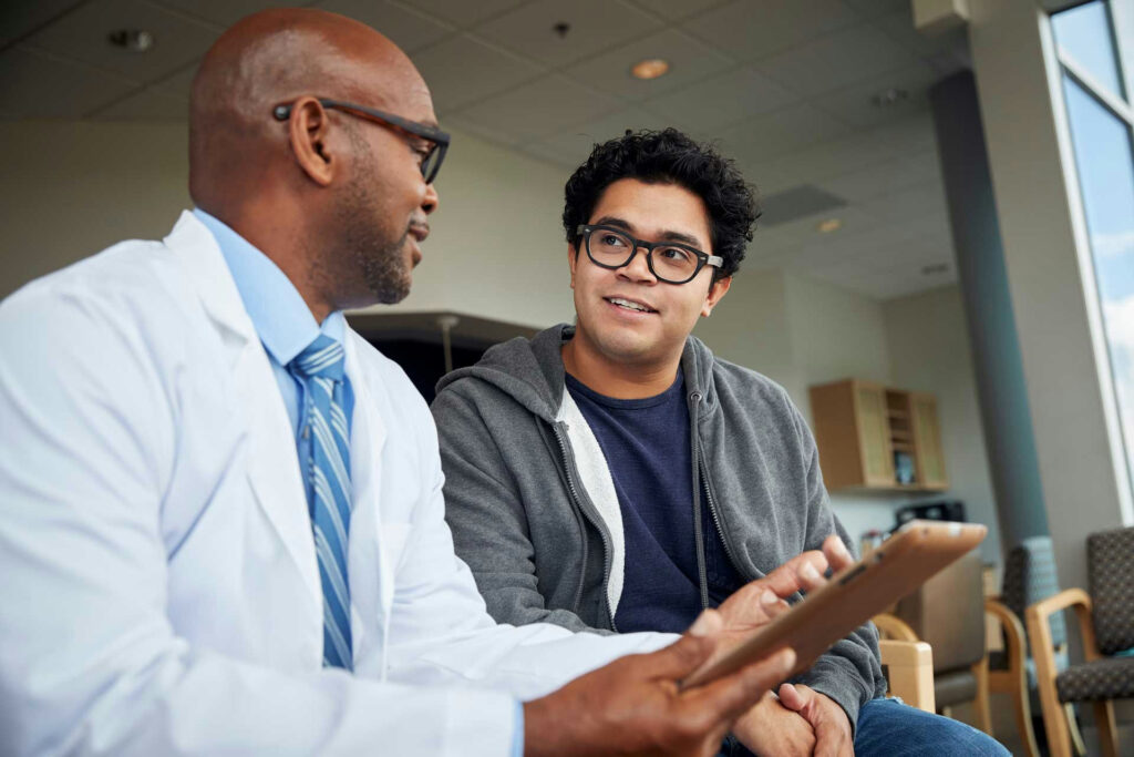 Teen meeting with a psychiatrist to discuss treatment options for OCD and ADHD symptoms.