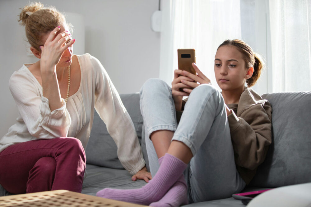 Parent feeling stressed and overwhelmed by teen behavioral challenges