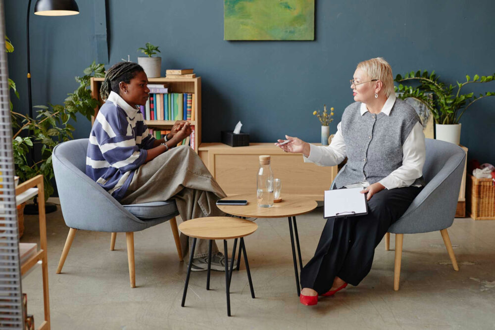 Teen participating in behavioral therapy session for conduct disorder or oppositional defiant disorder