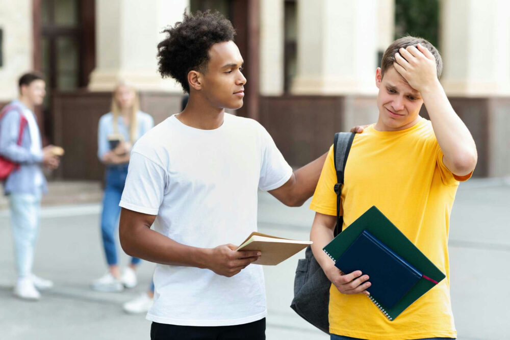 Student walking across a college campus while learning how to take care of mental health in college
